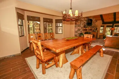 a dining room with a wooden table and chairs at Summit Lodge 1 in Big Bear Lake