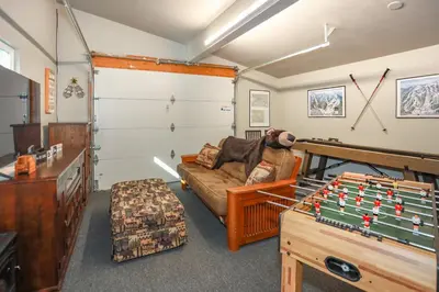 a living room with a couch and a table at Comet's Cabin in Big Bear Lake