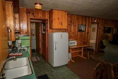 a kitchen with a white refrigerator and a sink at Mountain Air in Big Bear Lake