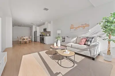 a living room with a couch and a table at Modern Retreat in Koreatown - Perfect for Your LA Stay! in Los Angeles