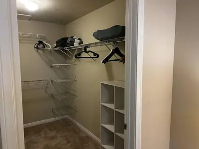 a walk in closet with shelves and a door at Spacious 1bdrm apartment 10 mins to Cedars-Sinai by car FREE Parking, King bed in Los Angeles