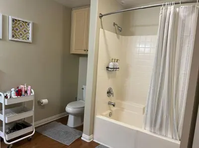 a bathroom with a shower and a white toilet at Spacious 1bdrm apartment 10 mins to Cedars-Sinai by car FREE Parking, King bed in Los Angeles