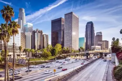 a city skyline with traffic on a highway at Chic Getaway Cozy Comfortable and Convenient with Two Bedrooms in Los Angeles