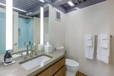 a bathroom with a sink and a toilet at Beachfront Villa Broad Beach Direct Beach Access in Malibu
