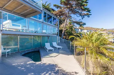 an external view of a house with a swimming pool at Beachfront Villa Broad Beach Direct Beach Access in Malibu