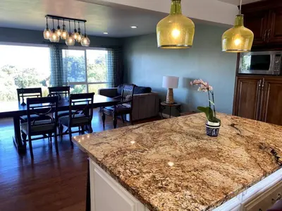 a kitchen and living room with a counter and a dining room at Hilltop Oasis Near Palos Verdes in San Pedro