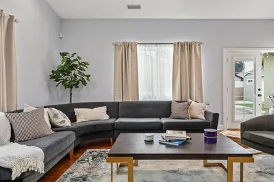 a living room with a couch and a coffee table at Goode Homes Luxury Family Home in Granada Hills