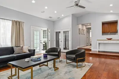a living room with a couch and chairs and a table at Goode Homes Luxury Family Home in Granada Hills