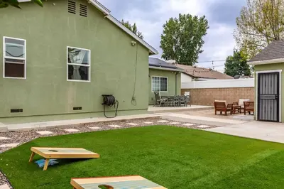 a yard with a green house with a lawn at Goode Homes Luxury Family Home in Granada Hills