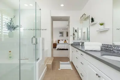 a bathroom with a glass shower and a sink at GOODE HOMES Luxury Modern Home with Pool and Spa in Santa Clarita