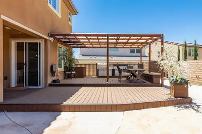 a pergola on a patio of a house at GOODE HOMES Luxury Modern Home with Pool and Spa in Santa Clarita