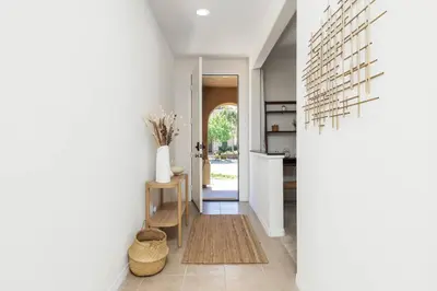 a hallway of a home with white walls and a hallway at GOODE HOMES Luxury Modern Home with Pool and Spa in Santa Clarita