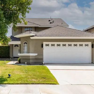 a house with a white garage in front of it at GOODE HOMES Luxury Modern Home with Jacuzzi in Santa Clarita