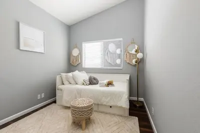 a white bedroom with a bed and a lamp at GOODE HOMES Luxury Modern Home with Jacuzzi in Santa Clarita