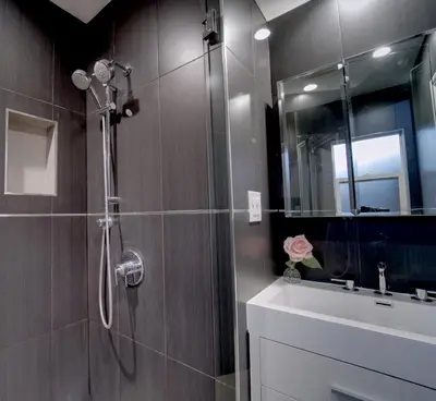 a bathroom with a shower with a sink and a mirror at Modern LA Home - King Bed, Outdoor Living, Firepit in Los Angeles