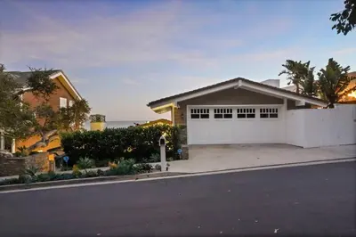 a house with a white garage at The Getaway Oceanfront Villa in Malibu by Stay Awhile in Malibu