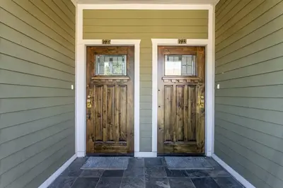 two doors on the side of a house at Getaway 4BR Home in the Heart of LA in Los Angeles