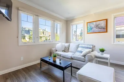 a living room with a couch and a table at Getaway 4BR Home in the Heart of LA in Los Angeles