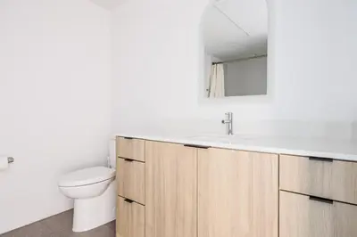 a bathroom with a sink and a toilet at Blueground Brentwood pool gym near metro LAX-1285 in Los Angeles