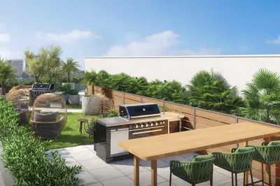a patio with a grill and a table and chairs at Blueground Brentwood pool gym near metro LAX-1285 in Los Angeles