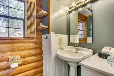 a bathroom with a sink and a mirror at Hot Tub, Grill and Fire Pit Cabin in Big Bear Lake in Big Bear Lake