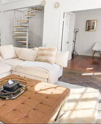 a living room with a white couch and a table at Stunning Mediterranean Mansion in Laurel Canyon in Los Angeles