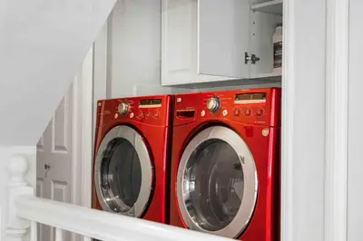 a red washer and dryer in a kitchen at Stunning Mediterranean Mansion in Laurel Canyon in Los Angeles
