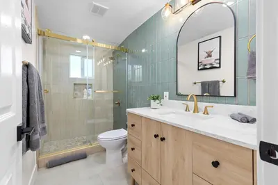 a bathroom with a toilet and a sink and a shower at Modern Anaheim Stay- Minutes to Disney& Family Fun in Anaheim