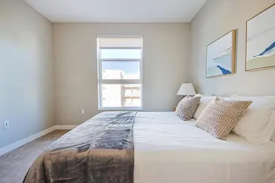 a large bed in a bedroom with a window at Hollywood Escape! Elegant 2BR 2BA Rental in Los Angeles