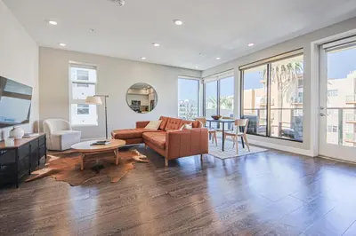 a living room with a couch and a table at Hollywood Escape! Elegant 2BR 2BA Rental in Los Angeles