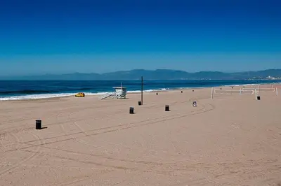 a beach with a volley ball net on the sand at Sofi LAX Clippers Stay in Inglewood
