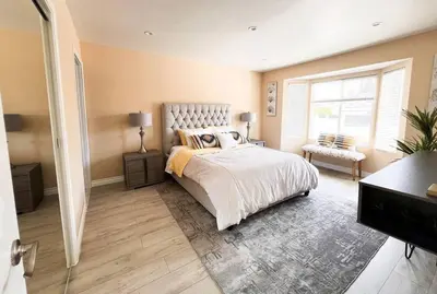 a bedroom with a large bed and a window at Luxury Oasis in Central Encino w Pool & Spa Topeka in Los Angeles