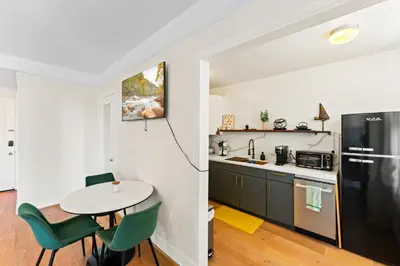 a kitchen with a table and a refrigerator at Ocean View Studio Near Convention Center and Beach in Long Beach