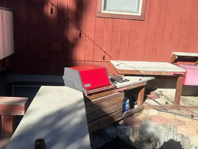 a red box sitting on top of a wooden table at Enjoy Privacy - Pine Mountain - Spacious Home in Pine Mountain Club