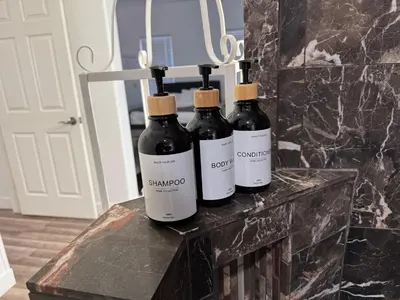 three bottles of wine sitting on top of a table at Enjoy Privacy - Pine Mountain - Spacious Home in Pine Mountain Club