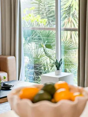 a bowl of fruit on a table in front of a window at Sunny 1BR with Large Outdoor Lounge Space - SH4LAD in Los Angeles