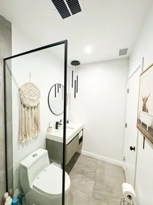 a white bathroom with a toilet and a sink at Sunny 1BR with Large Outdoor Lounge Space - SH4LAD in Los Angeles