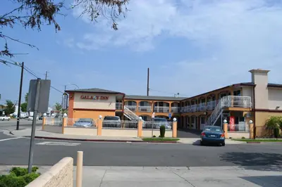 a building with a car parked in front of it at Galaxy Inn in Los Angeles