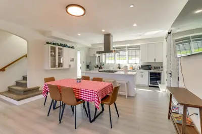 a kitchen and dining room with a table and chairs at 1 Mi to Dtwn Pasadena! Newly Built Home in Pasadena