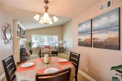a dining room with a table and chairs in a room at Charming Bedroom Near Disney Land, Orange County in La Palma