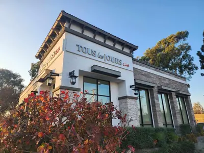 a building with a sign on the side of it at Charming Bedroom Near Disney Land, Orange County in La Palma