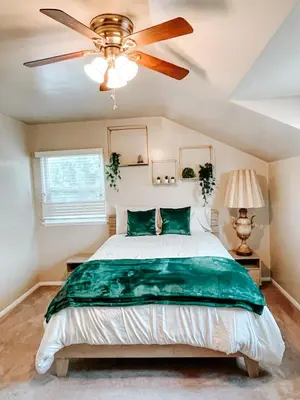 a bedroom with a bed and a ceiling fan at Lovely home close by SOFI Stadium in Inglewood