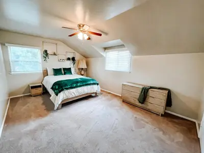 a bedroom with a bed and a ceiling fan at Lovely home close by SOFI Stadium in Inglewood