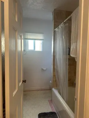 a bathroom with a shower and a bath tub at Cozy Studio In West Hollywood in Los Angeles