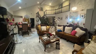 a living room with couches and a table at villa Double Room in Chino Hills