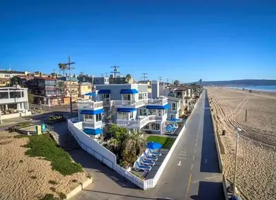 a house on the beach next to the beach at 90210 Beach House Middle Unit in Hermosa Beach