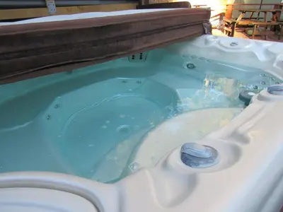 a blue tub with a toilet in it at Forest Moon Cottage in Big Bear City Airport