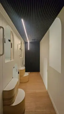 a bathroom with three sinks and a black ceiling at Brimfield Stay in Los Angeles