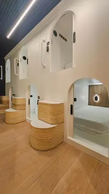 a room with a bed and two mirrors at Brimfield Stay in Los Angeles