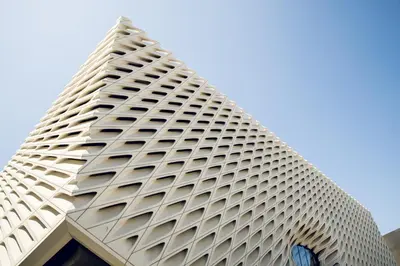 a tall white building with many windows at American Hotel in Los Angeles